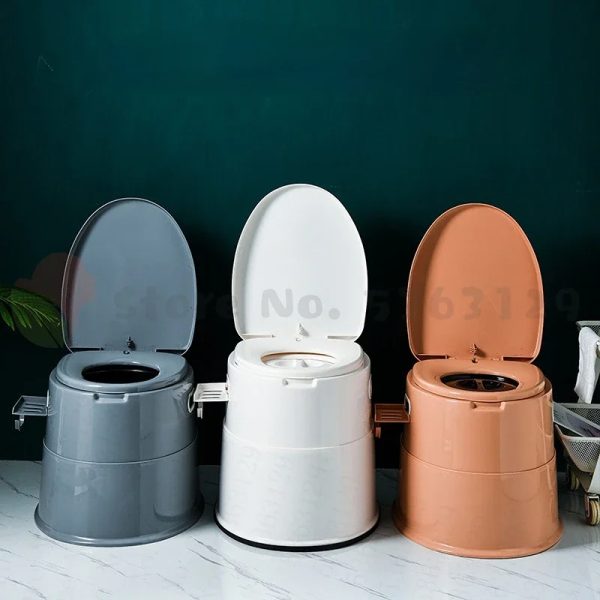 A portable toilet seat folded up for compact storage, with a carrying handle