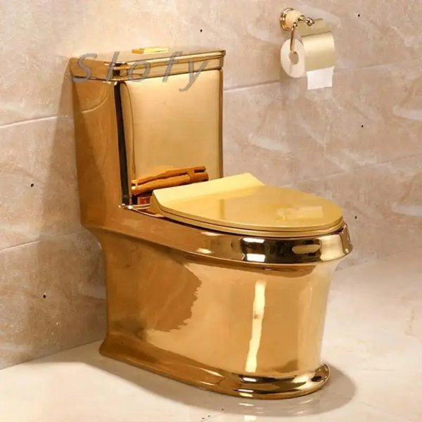 Close-up view of a gold toilet bowl, highlighting its luxurious and opulent design.