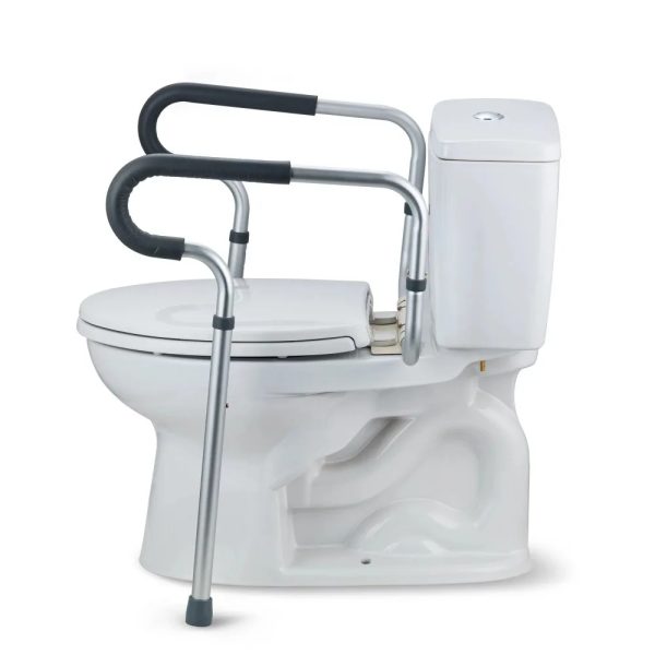 Elderly person using Equate toilet safety rail for support in the bathroom