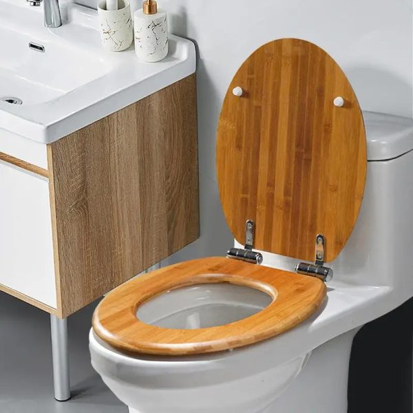 Close-up photo of a luxurious wooden toilet seat with lid, showcasing its natural beauty and warmth.