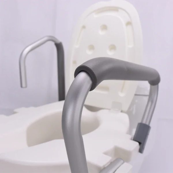 Senior person using the elevated toilet seat riser with a secure grab bar for added support.