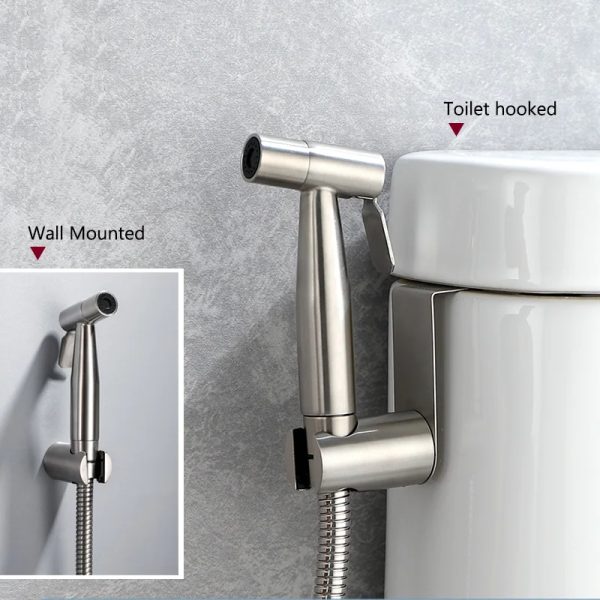 Close-up photo of a stainless steel bidet sprayer attached to a toilet, emphasizing its role in enhancing bathroom hygiene.