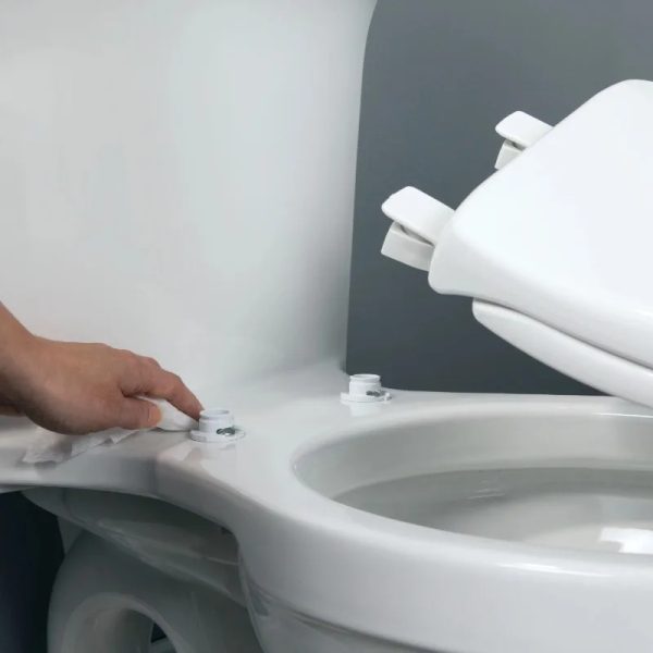 Close-up photo of the toilet seat hinges, showcasing their sturdiness and stability.